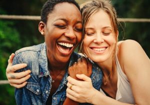 two women hugging in relapse prevention therapy