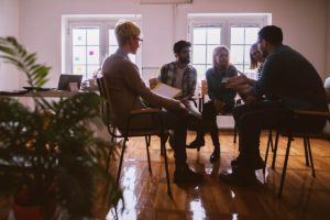 patients in treatment learning what is group therapy