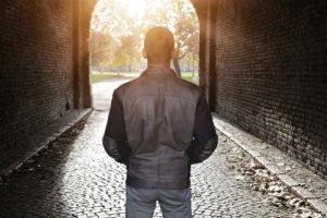 man looking through walkway in a drug and alcohol detox center