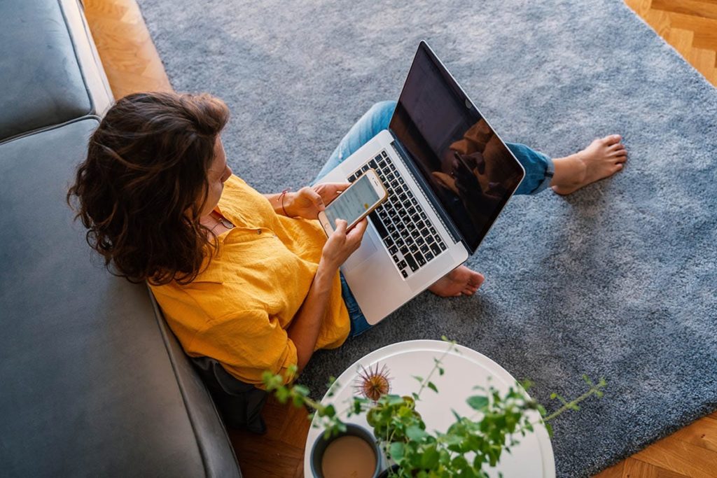 woman on laptop working on an act program