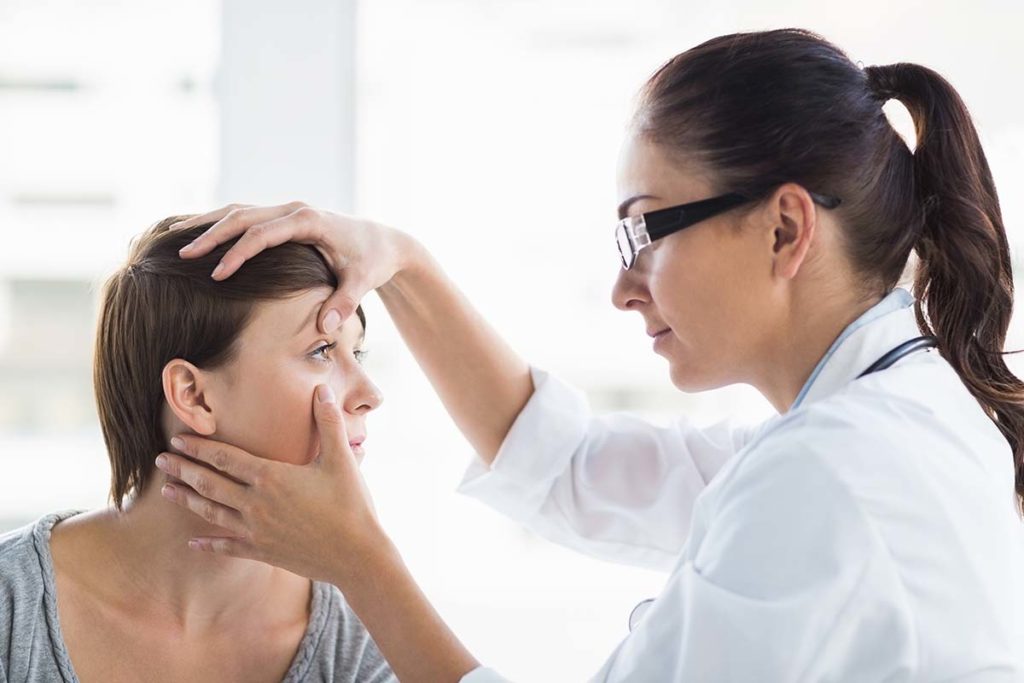 therapist touches client's head while explaining emdr therapy what is it