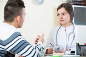 clinician talks with client about how long is an intensive outpatient program