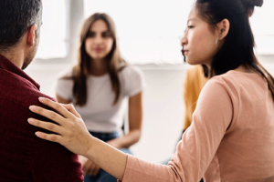 people in a group session in a drug detox center