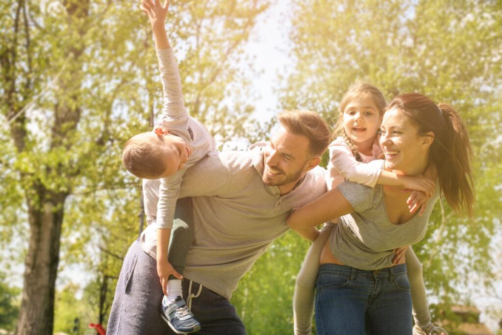 family outdoors participates in family therapy activities