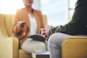 Two people discuss the benefits of psychotherapy